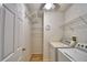 Functional laundry room with washer, dryer, and shelving for ample storage at 2350 Paulette Dr, Haines City, FL 33844