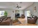 Spacious living room featuring vaulted ceilings, tile flooring, and comfortable leather furniture at 2350 Paulette Dr, Haines City, FL 33844