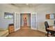 Bright office with French doors and views of the hallway and a bathroom at 2350 Paulette Dr, Haines City, FL 33844