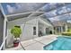 Exterior backyard view of home with screened-in lanai and pool at 2350 Paulette Dr, Haines City, FL 33844