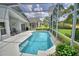 Screened-in swimming pool with patio, ceiling fan, and view of backyard at 2350 Paulette Dr, Haines City, FL 33844