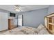 Cozy bedroom with ample space, a ceiling fan, and a large window offering natural light at 2602 Whitewood Rd, Mulberry, FL 33860