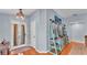 Stylish entryway featuring hardwood floors, decorative shelving, and a bright front door at 2602 Whitewood Rd, Mulberry, FL 33860