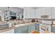 Charming kitchen featuring two-tone cabinets, modern appliances, and open view to living area at 2602 Whitewood Rd, Mulberry, FL 33860