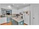 Open-concept living space with kitchen and dining area is perfect for gatherings at 2602 Whitewood Rd, Mulberry, FL 33860