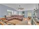 Bright living room featuring hardwood floors, ample seating, and stylish decor at 2602 Whitewood Rd, Mulberry, FL 33860