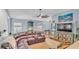 Spacious living room with hardwood floors, comfortable furniture, and natural light at 2602 Whitewood Rd, Mulberry, FL 33860