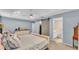 Serene main bedroom with ensuite bathroom, closet barn door, and light-colored walls at 2602 Whitewood Rd, Mulberry, FL 33860