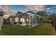 Backyard pool featuring a screened enclosure, patio, and relaxing outdoor seating, perfect for enjoying the Florida lifestyle at 2602 Whitewood Rd, Mulberry, FL 33860