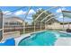Screened pool with outdoor seating offering ample space to relax and enjoy the backyard view at 2602 Whitewood Rd, Mulberry, FL 33860
