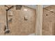 Modern shower featuring a multi-setting shower head, built in seat and convenient shelving for toiletries at 2602 Whitewood Rd, Mulberry, FL 33860