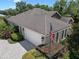 Desirable residence boasts landscaping, shingle roof and convenient attached garage at 2977 Sequoyah Dr, Haines City, FL 33844