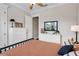 Bright bedroom with a black metal bed frame and white dressers on each side of the bed at 2977 Sequoyah Dr, Haines City, FL 33844