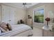 Bright bedroom with neutral tones, plush carpet, window with natural light, and decorative furnishings at 2977 Sequoyah Dr, Haines City, FL 33844