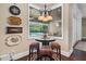 Breakfast nook features table, chairs, and pool view at 2977 Sequoyah Dr, Haines City, FL 33844