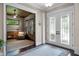 Inviting foyer with decorative glass double doors and an adjacent room at 2977 Sequoyah Dr, Haines City, FL 33844