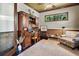 Cozy home office with custom built-ins, comfortable seating, and natural light at 2977 Sequoyah Dr, Haines City, FL 33844