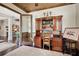 Well-appointed home office with custom desk, wood accents, and views to the foyer at 2977 Sequoyah Dr, Haines City, FL 33844