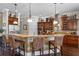 Spacious kitchen island with barstool seating, granite countertops, and pendant lighting at 2977 Sequoyah Dr, Haines City, FL 33844