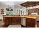 Kitchen featuring stainless appliances, hardwood floors, and granite countertops at 2977 Sequoyah Dr, Haines City, FL 33844