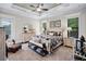 Serene main bedroom with a patterned quilt, neutral colors, and natural light from the windows at 2977 Sequoyah Dr, Haines City, FL 33844