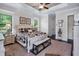 Comfortable main bedroom with a reading chair, accent pillows, and natural light throughout at 2977 Sequoyah Dr, Haines City, FL 33844
