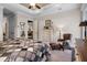 Calm main bedroom featuring a cozy reading chair, walk-out patio door and light-colored furnishings at 2977 Sequoyah Dr, Haines City, FL 33844