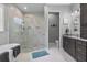 This elegant bathroom has a tub, glass enclosed shower, and double sink at 2988 Sequoyah Dr, Haines City, FL 33844