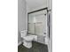 Modern bathroom features a subway tiled shower-tub with glass door and black fixtures at 2988 Sequoyah Dr, Haines City, FL 33844