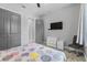 Bedroom with wood-look floors, a ceiling fan, and gray doors at 2988 Sequoyah Dr, Haines City, FL 33844