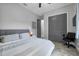 Bedroom with grey walls, wood-look floors, and an office chair at 2988 Sequoyah Dr, Haines City, FL 33844