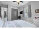 A comfortable bedroom featuring a TV, closet, and neutral paint color with natural light from the window at 2988 Sequoyah Dr, Haines City, FL 33844