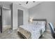 Bedroom with wood-look floors, a ceiling fan, and a view of the doorway at 2988 Sequoyah Dr, Haines City, FL 33844