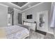 Comfortable bedroom with a decorative dresser, TV, and access to a private outdoor area at 2988 Sequoyah Dr, Haines City, FL 33844