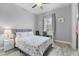 Bedroom with wood-look floors, a ceiling fan, and a writing desk near the window at 2988 Sequoyah Dr, Haines City, FL 33844