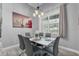 Elegant dining room boasting a contemporary table with seating for six and large window views at 2988 Sequoyah Dr, Haines City, FL 33844