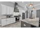 Modern kitchen featuring white cabinets, stainless steel appliances, and sleek countertops at 2988 Sequoyah Dr, Haines City, FL 33844