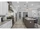 Well-appointed kitchen with modern appliances, granite counters, and convenient breakfast bar seating at 2988 Sequoyah Dr, Haines City, FL 33844