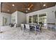 The covered lanai includes an outdoor dining set, offering a relaxing view of the pool area at 2988 Sequoyah Dr, Haines City, FL 33844