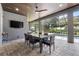 Beautiful lanai features an outdoor dining area and screened-in pool, perfect for entertaining at 2988 Sequoyah Dr, Haines City, FL 33844