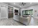 Stylish living room featuring custom built-ins, fireplace, and sliding glass doors to a screened lanai at 2988 Sequoyah Dr, Haines City, FL 33844