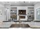 Bright living room with built-in shelves, fireplace, and cozy seating, ideal for relaxing and entertaining at 2988 Sequoyah Dr, Haines City, FL 33844