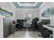 Spacious home office with dual workstations, stylish decor, and serene natural light at 2988 Sequoyah Dr, Haines City, FL 33844