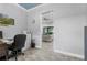 Office space with wood floors, a light blue ceiling, and a view into the living room at 2988 Sequoyah Dr, Haines City, FL 33844