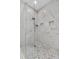 The glass shower features marble tiling, mosaic floors and built-in niches at 2988 Sequoyah Dr, Haines City, FL 33844