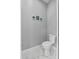 Toilet features marble flooring and neutral wall decor at 2988 Sequoyah Dr, Haines City, FL 33844