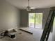 Bright bedroom includes carpet, a ceiling fan, and a screened-in porch at 300 E Washington St, Minneola, FL 34715