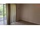 Bedroom featuring carpeted floors, natural light, and neutral wall color at 300 E Washington St, Minneola, FL 34715
