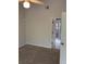 Neutral bedroom features carpet, a ceiling fan, and an attached bathroom with a standing shower at 300 E Washington St, Minneola, FL 34715