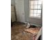 Kitchen features a window, linoleum flooring, and a door to the exterior at 300 E Washington St, Minneola, FL 34715